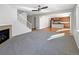 Spacious living room features a fireplace and open concept to kitchen at 6356 Blue Water Cir, Castle Rock, CO 80108