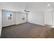 Large main bedroom with carpet, dual windows, and access to bathroom at 6356 Blue Water Cir, Castle Rock, CO 80108