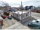 A compact building with a flat roof is nestled in a lot with parking and nearby access to city streets at 421 E Alameda Ave, Denver, CO 80209