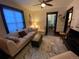 Cozy living room features a comfortable sofa, patterned rug, and decorative elements, creating an inviting space at 421 E Alameda Ave, Denver, CO 80209