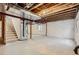Unfinished basement featuring exposed ceiling, a staircase, and a small window for natural light at 10273 Bentwood Ln, Highlands Ranch, CO 80126