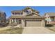 Charming two-story home features a well-manicured lawn, neutral siding, and a spacious two-car garage at 10273 Bentwood Ln, Highlands Ranch, CO 80126