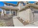 Inviting entryway with a stylish front door, brick accents, and a well-maintained walkway at 10273 Bentwood Ln, Highlands Ranch, CO 80126