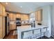 Bright kitchen featuring stainless steel appliances, ample cabinet space, and a large island at 10273 Bentwood Ln, Highlands Ranch, CO 80126