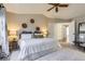Inviting main bedroom featuring a ceiling fan, vaulted ceiling, soft carpet and ample lighting at 10273 Bentwood Ln, Highlands Ranch, CO 80126