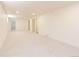 A spacious carpeted basement area, ready to be transformed into a customized living space at 5882 W Chestnut Ave, Littleton, CO 80128