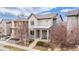 Attractive two-story home featuring a covered front porch, and neatly landscaped yard at 6723 Raritan Dr, Denver, CO 80221