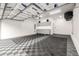 A bright and spacious garage with custom storage solutions and a durable floor at 6723 Raritan Dr, Denver, CO 80221