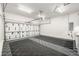 Spacious and clean garage interior featuring ample storage and a durable, patterned floor at 6723 Raritan Dr, Denver, CO 80221