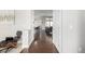 Hallway view showcases the home's open layout, with the kitchen and living room visible from the entryway at 6723 Raritan Dr, Denver, CO 80221