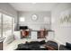 A modern home office has built-in desks, comfortable seating, and natural light for a productive and stylish workspace at 6723 Raritan Dr, Denver, CO 80221
