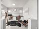 A home office featuring modern furniture, built-in desks, and a comfortable seating area, creating a functional workspace at 6723 Raritan Dr, Denver, CO 80221