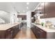 Spacious kitchen showcases stainless steel appliances, wine cooler, and ample cabinet storage at 6723 Raritan Dr, Denver, CO 80221