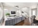 Bright living room boasts stylish gray sectional sofa, hardwood floors, and contemporary decor at 6723 Raritan Dr, Denver, CO 80221