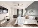 Serene main bedroom with modern ceiling fan, neutral decor, and stylish accents at 6723 Raritan Dr, Denver, CO 80221