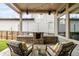 Outdoor patio featuring built-in grill, outdoor seating, string lights and privacy fence at 6723 Raritan Dr, Denver, CO 80221
