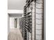 Spacious wine cellar with extensive wall-mounted racking for displaying a large collection of wines at 6723 Raritan Dr, Denver, CO 80221