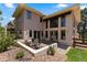 Stunning backyard with patio, lush landscaping, and privacy fence at 69 N Ranch Rd, Littleton, CO 80127