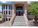 Inviting front entrance with well-maintained steps, providing a welcoming path to the home's entrance at 69 N Ranch Rd, Littleton, CO 80127