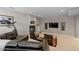 Comfortable living room with cozy fireplace, entertainment center, and plush seating at 69 N Ranch Rd, Littleton, CO 80127