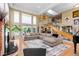 Bright, open living room showcases soaring ceilings, generous natural light, and stylish staircase and decor at 69 N Ranch Rd, Littleton, CO 80127