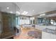 Modern bathroom boasts double vanities, soaking tub, skylight and frameless glass shower at 69 N Ranch Rd, Littleton, CO 80127