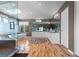 Large main bathroom featuring double vanity, modern shower, and soaking tub beneath skylight at 69 N Ranch Rd, Littleton, CO 80127