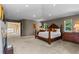 Spacious main bedroom featuring a king bed, and large windows providing ample natural light at 69 N Ranch Rd, Littleton, CO 80127