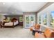 Bright main bedroom with a seating area and a scenic view of the natural landscape at 69 N Ranch Rd, Littleton, CO 80127