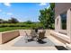 Charming patio with seating area and views of the landscaped backyard at 69 N Ranch Rd, Littleton, CO 80127