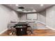 Basement entertainment area featuring arcade machine and a large screen for movie nights at 16267 W 59Th Pl, Golden, CO 80403