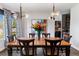 Elegant dining room featuring a large table, stylish lighting, and vibrant artwork at 16267 W 59Th Pl, Golden, CO 80403