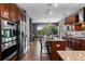 Spacious kitchen with stainless steel appliances, granite counters, and a breakfast bar at 16267 W 59Th Pl, Golden, CO 80403