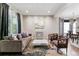 Stylish living room with neutral tones, elegant decor, and ample natural light at 16267 W 59Th Pl, Golden, CO 80403
