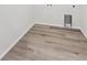 Laundry room with wood-look vinyl flooring at 803 Goodrich Peak St, Erie, CO 80516