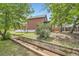 Backyard featuring a charming water feature and brick house at 3655 Zenobia St, Denver, CO 80212