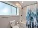 Bathroom features shower-tub combo with modern fixtures and natural light at 3655 Zenobia St, Denver, CO 80212