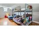 Spacious bedroom featuring bunkbeds and natural light from a window at 3655 Zenobia St, Denver, CO 80212