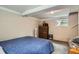 Basement bedroom featuring a bed and natural light from a window at 3655 Zenobia St, Denver, CO 80212