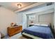 Cozy basement bedroom featuring a bed, window, and charming floral-designed chest at 3655 Zenobia St, Denver, CO 80212