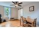 Dining room with natural light, ceiling fan, barn door, and decorative wall art at 3655 Zenobia St, Denver, CO 80212