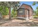 Backyard featuring brickwork, a tree and greenery at 3655 Zenobia St, Denver, CO 80212