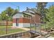 Quaint brick home featuring charming architectural details and a small bridge leading to the entrance at 3655 Zenobia St, Denver, CO 80212