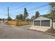 Exterior shot of the two-car garage showcasing access from a fenced-in alleyway at 3655 Zenobia St, Denver, CO 80212
