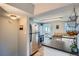 Bright kitchen with stainless appliances and eat-in bar top at 3655 Zenobia St, Denver, CO 80212