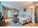 Inviting living room with hardwood floors, neutral paint, and a cozy seating area at 3655 Zenobia St, Denver, CO 80212
