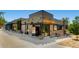 Modern restaurant with a stylish exterior, featuring glass doors and outdoor seating, creating a welcoming atmosphere at 3655 Zenobia St, Denver, CO 80212