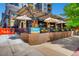 Restaurant exterior with a covered patio, brick facade, and ample outdoor seating at 3655 Zenobia St, Denver, CO 80212