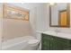 Bathroom featuring a green vanity and a tub shower combination at 342 Brook Cir, Boulder, CO 80302