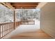 Outdoor deck framed by wooden beams overlooking snow-covered trees at 342 Brook Cir, Boulder, CO 80302
